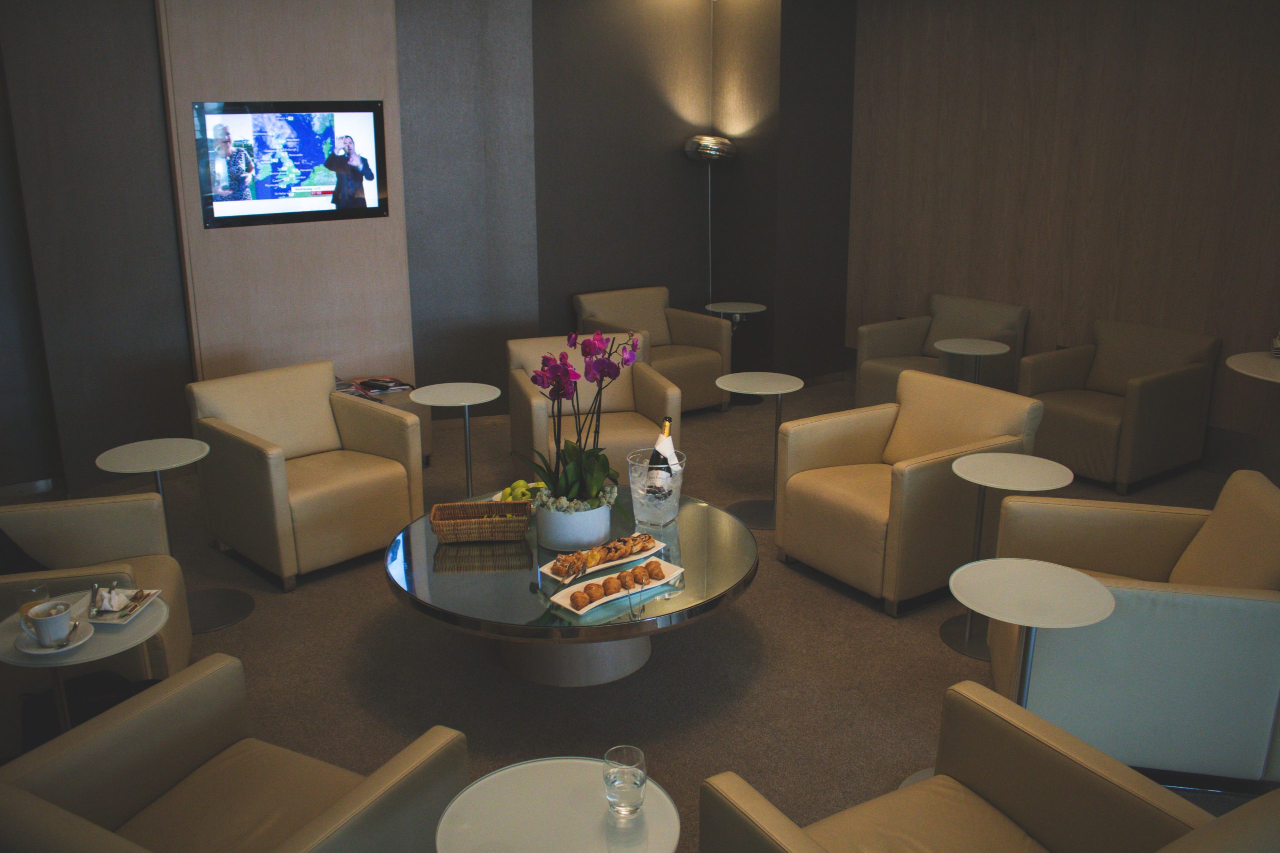 Quiet luxury airport lounge with comfortable seating, a calm setting for discreet travel.