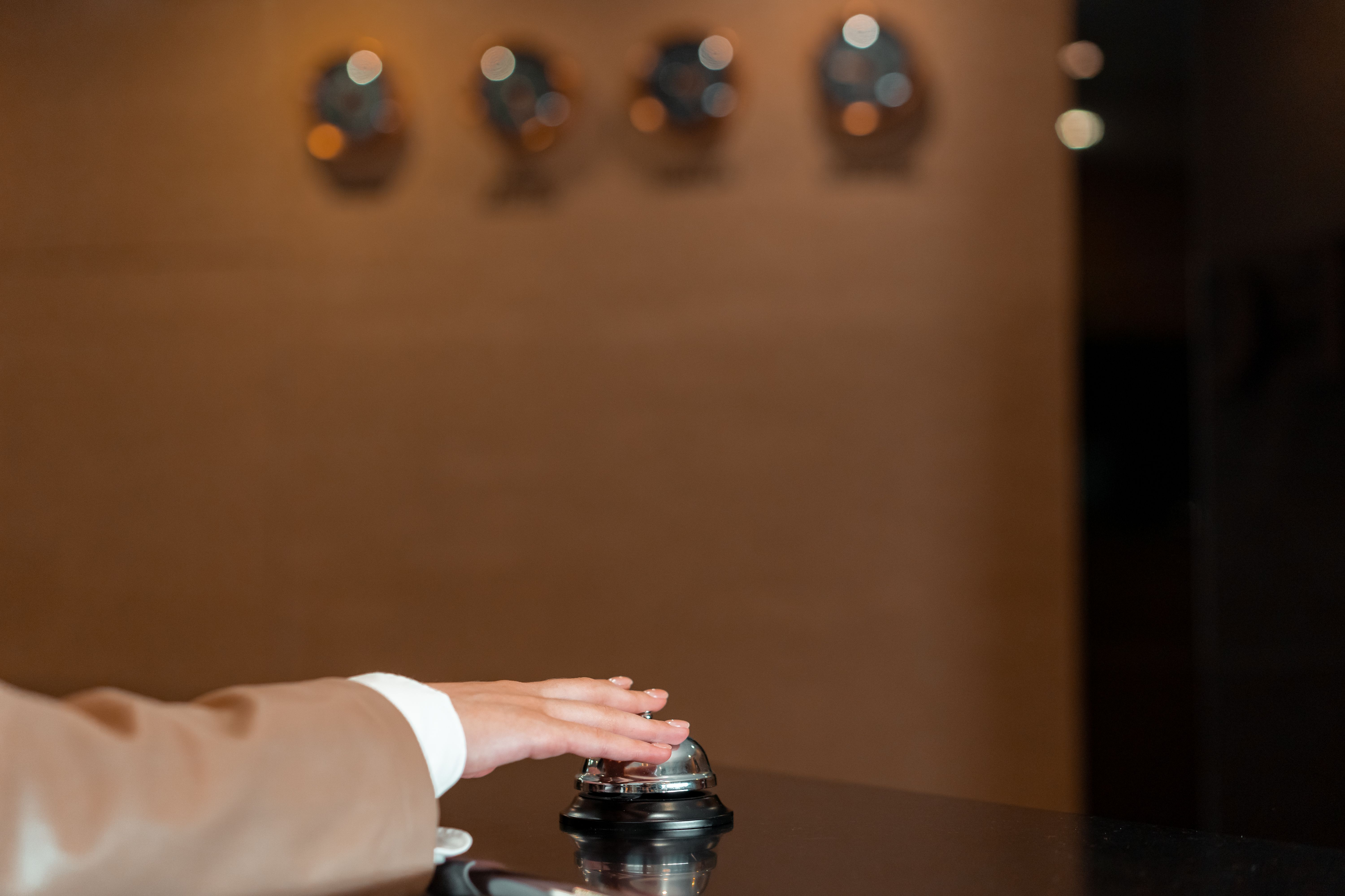 Hotel reception bell representing personalized concierge service during a private luxury stay.